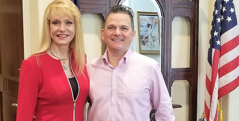 Conroe ISD Education Foundation Chair Nelda Luce Blair, left, thanks Commissioner James Noack as he personally delivers The Noack Foundation funds for the largest scholarship ever presented by the Conroe ISD Education Foundation.